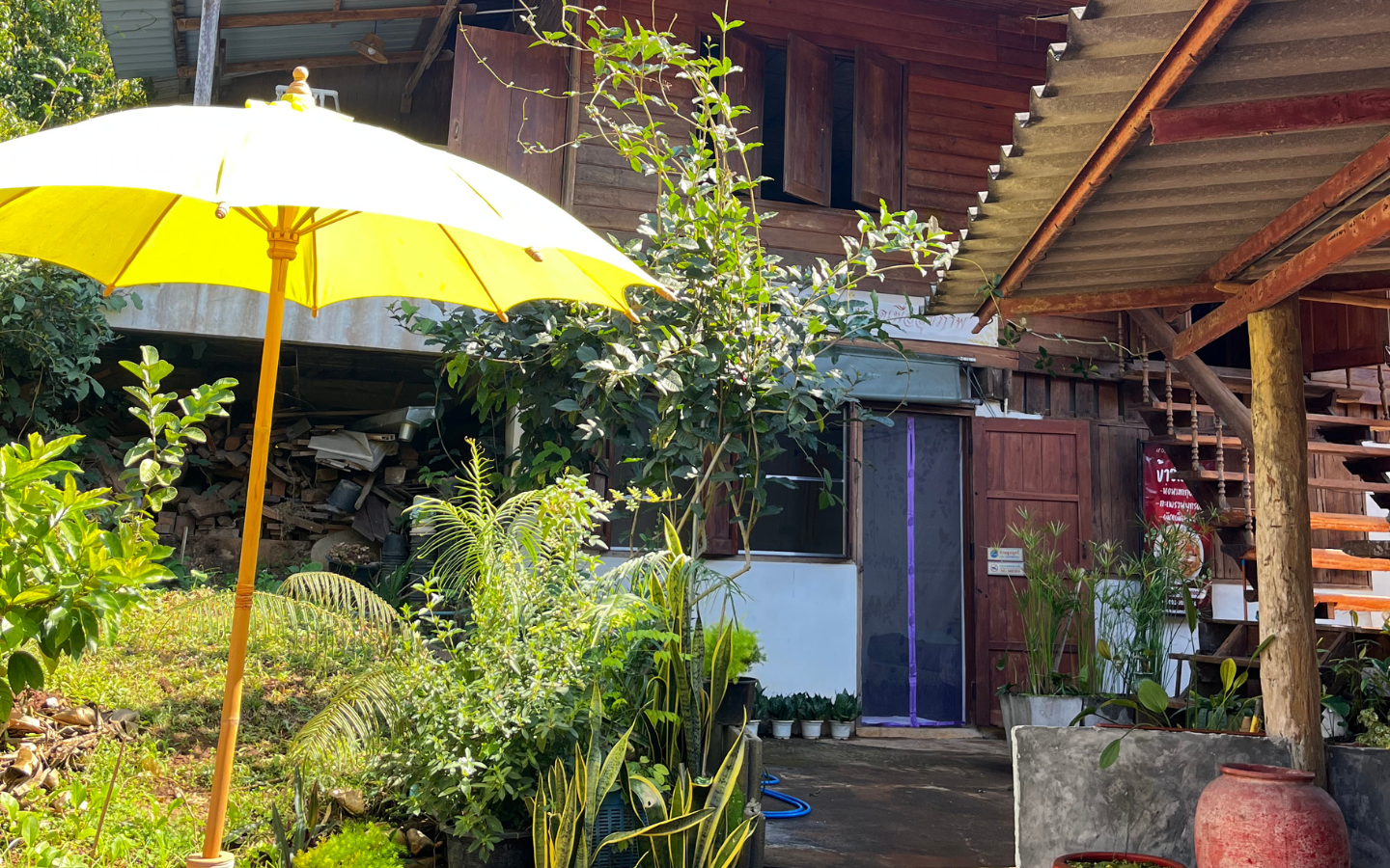 Serene Thai wellness spa massage room with soft linens and warm ambient candlelight.